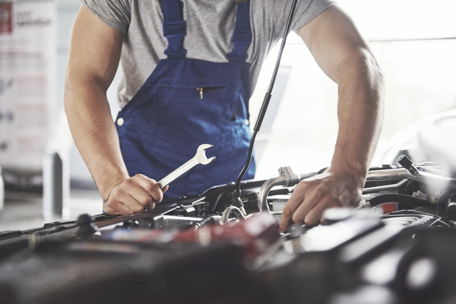 Mechanic repairing a vehicle engine